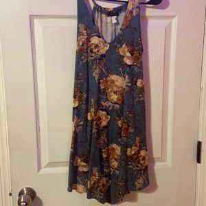 a tealish dress with multi colored flowers